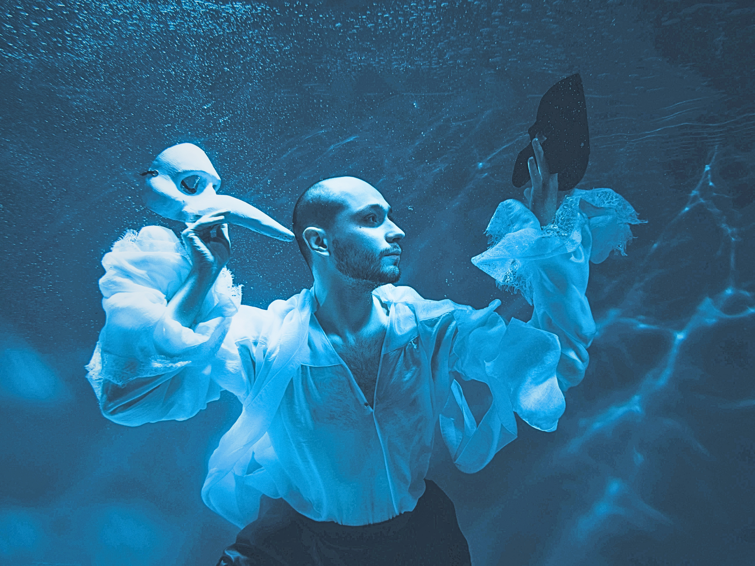 Man in Shirt Posing Underwater and Holding Theatre Mask Img Meditation Research 1